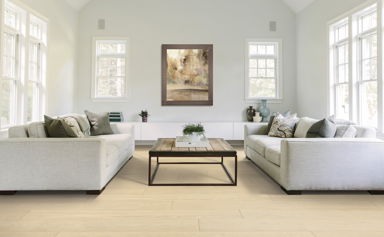 warm toned wood flooring in living room with minimalistic decor